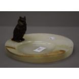 A cold painted bronze model of an owl, on an onyx base. The owl 8 cm high.
