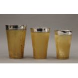 A set of three silver mounted horn hunt cups. The largest 12.25 cm high.