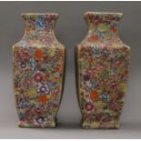 A pair of Chinese florally decorated porcelain vases. 33 cm high.