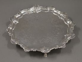 A Georgian silver salver with engraved decoration. 30 cm wide. 648.7 grammes.