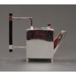 A Christopher Dresser style teapot. 15.5 cm high.