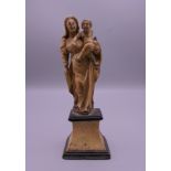 An 18th century Dieppe ivory carving of The Madonna and Child. 14 cm high.