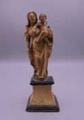 An 18th century Dieppe ivory carving of The Madonna and Child. 14 cm high.