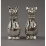 A pair of silver plated cat and dog peppers. 10.5 cm high.