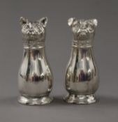 A pair of silver plated cat and dog peppers. 10.5 cm high.