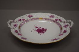 A Herend twin handled porcelain plate. 27.5 cm wide.