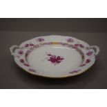 A Herend twin handled porcelain plate. 27.5 cm wide.