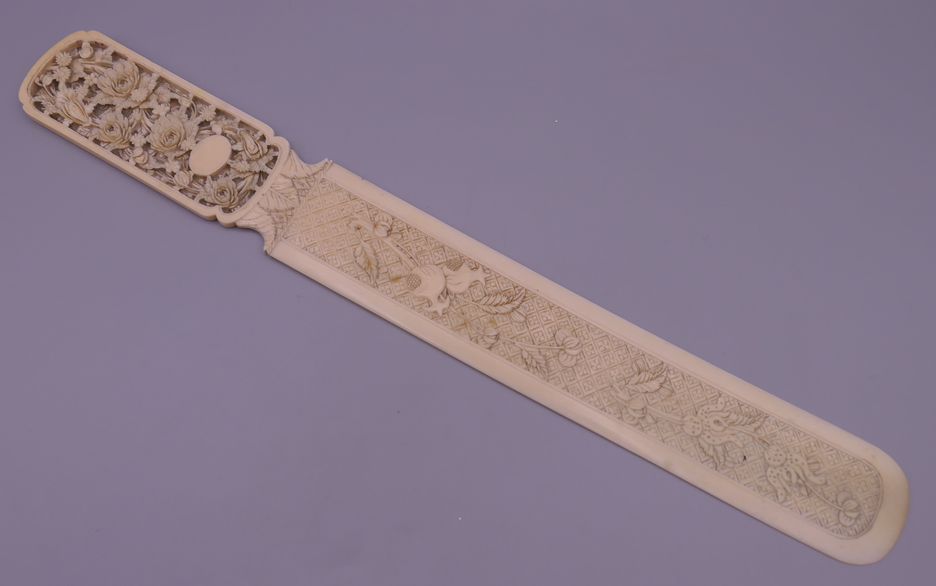 A 19th century Canton carved ivory letter opener. 32 cm long. 46.5g.