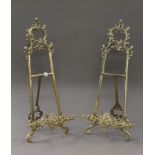 A pair of brass table easels. 52 cm high.
