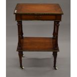 A 19th century French inlaid two tier table. 55 cm wide.