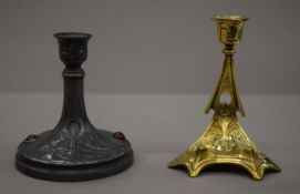 Two Art Nouveau candlesticks, one with a pen holder. The latter 14.5 cm high.