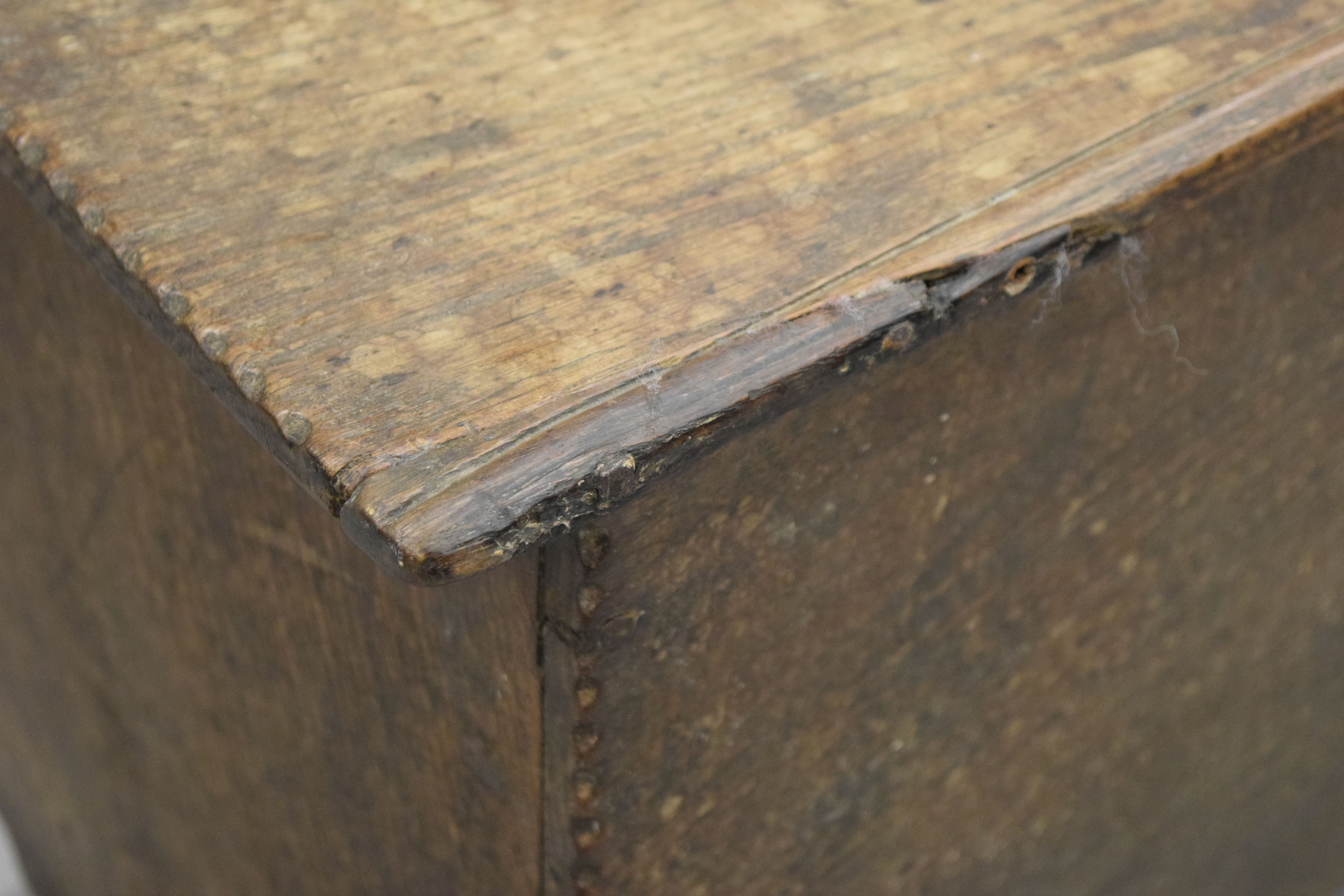 A small early 17th century oak six plank coffer. 90 cm long. - Image 6 of 7