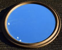 A large Victorian gilt framed oval mirror. 115 cm wide.