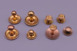A quantity of 9 ct gold studs (5.3 grammes) and two 18 ct gold studs (2.6 grammes).