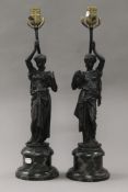 A pair of bronze figural lamps. 55 cm high overall.