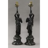 A pair of bronze figural lamps. 55 cm high overall.