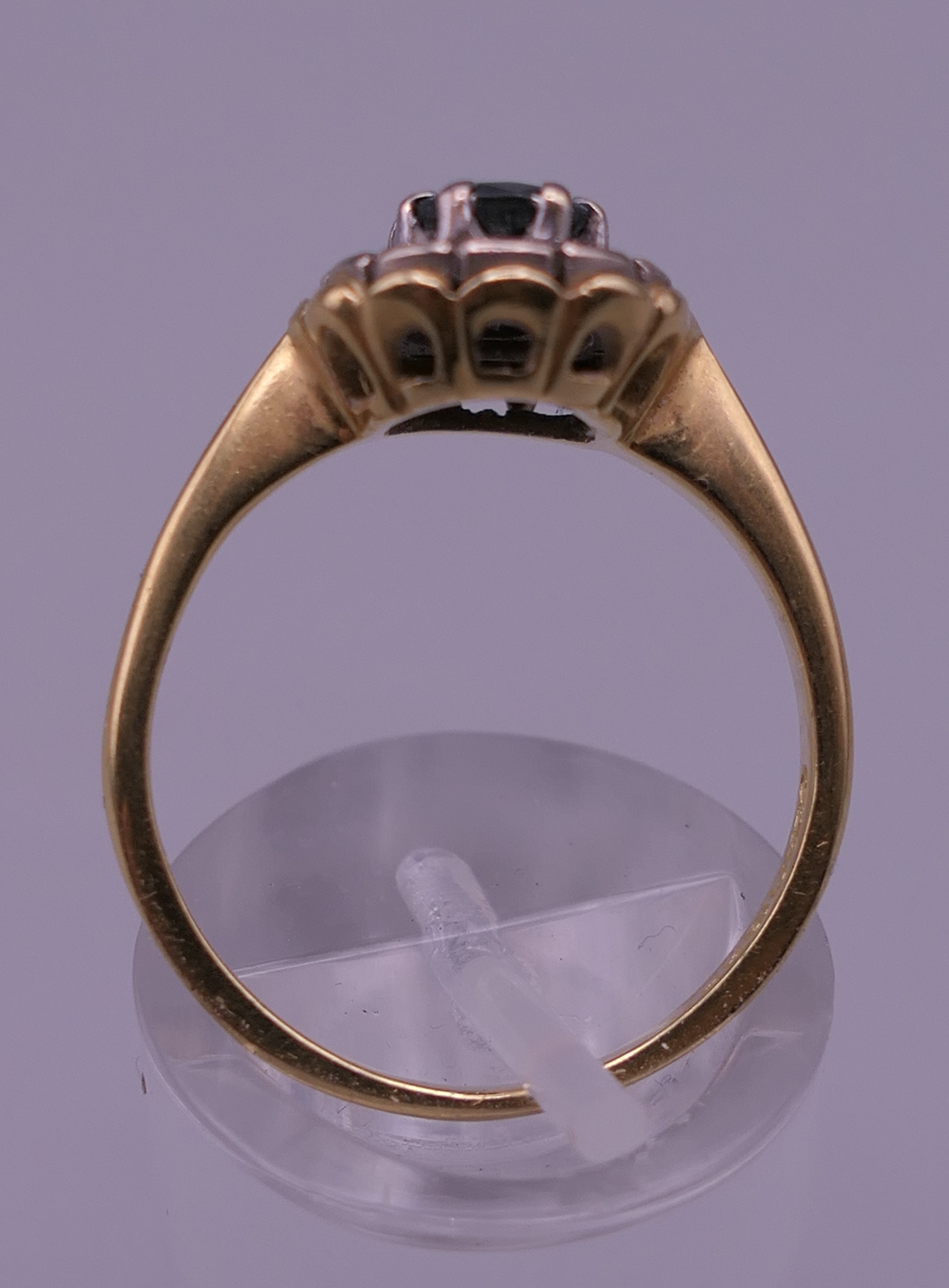 An 18 ct gold diamond and sapphire ring. Ring size P/Q. 4.9 grammes total weight. - Image 3 of 6