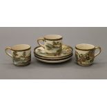 Three 19th century Japanese Satsuma cups and saucers. The cups 5 cm high.