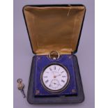 A 935 silver pocket watch mounted in a watch holder/case. The case 8.5 cm wide.