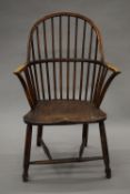 A primitive 18th century Windsor chair by Gillows. 58.5 cm wide.