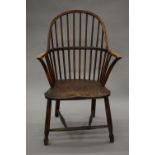 A primitive 18th century Windsor chair by Gillows. 58.5 cm wide.