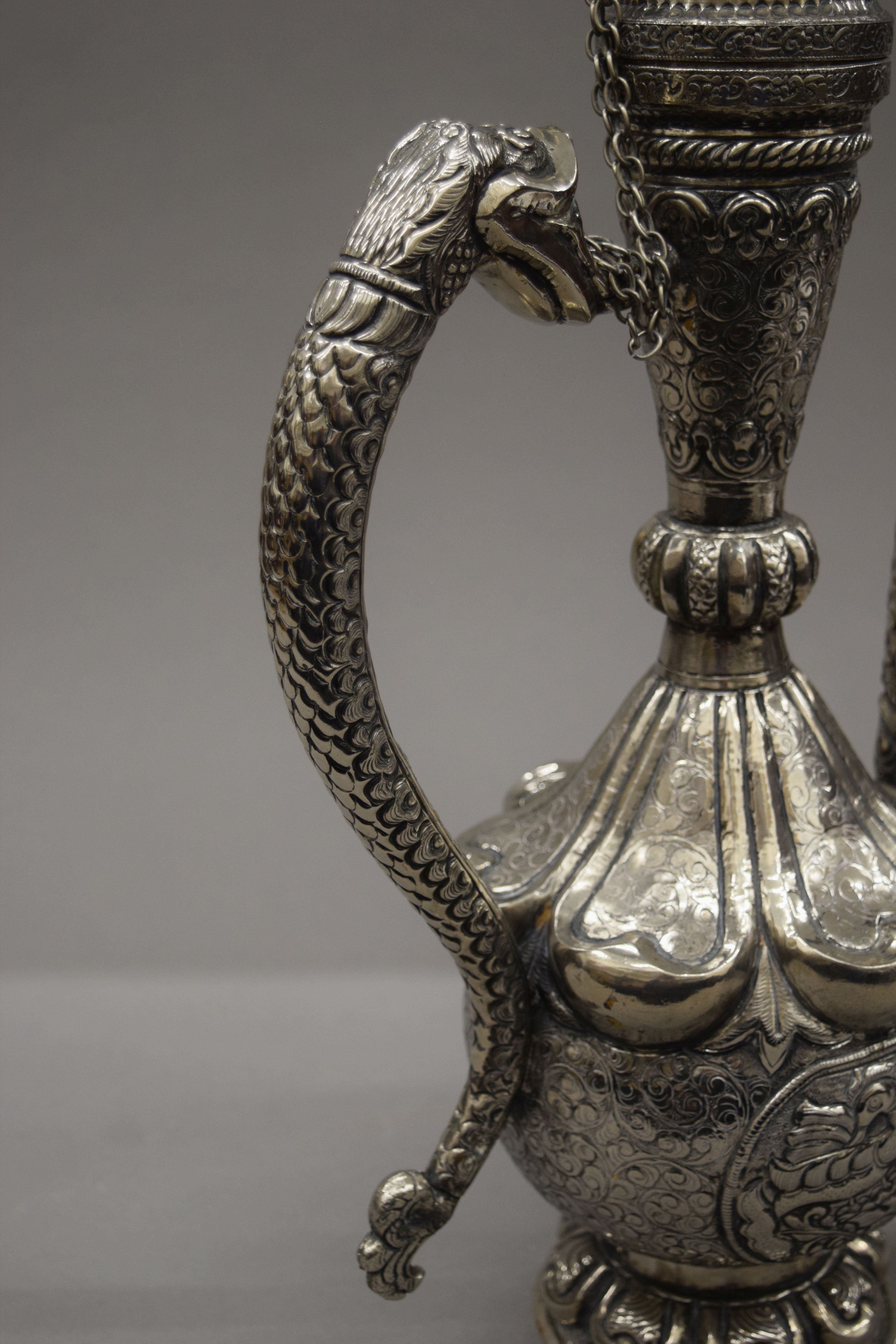 A Tibetan silver on copper repousse decorated ewer. 49 cm high. - Image 3 of 5