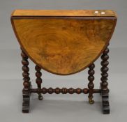 A small Victorian walnut Sutherland table. 53.5 cm high.