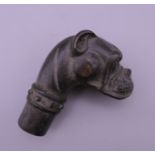 A bronze walking stick handle formed as a dog. 7 cm high.