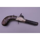 A 19th century white metal inlaid percussion pistol, the barrel inscribed Reilly London. 16 cm long.