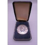 A boxed silver National Federation of Anglers medallion. 5 cm diameter. 57.8 grammes.