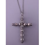 A Thomas Sabo 925 silver skull crucifix pendant on a silver chain. The pendant 4.75 cm high. 12.