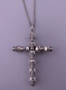 A Thomas Sabo 925 silver skull crucifix pendant on a silver chain. The pendant 4.75 cm high. 12.