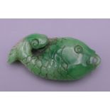 A Chinese carved jade pendant formed as a fish. 7.5 cm long.