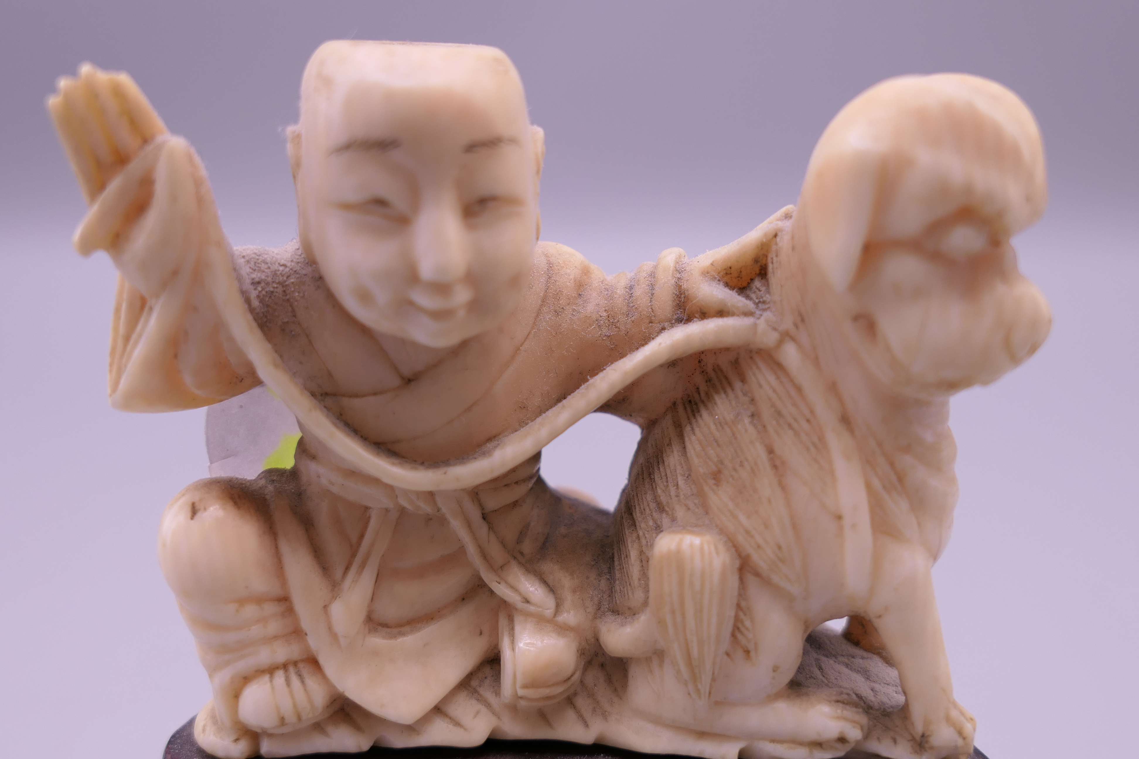 A 19th century Chinese carved ivory model of a boy and dog, mounted on a pierced wooden stand. 7. - Image 4 of 5