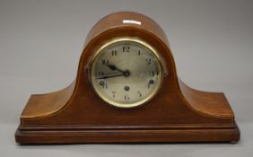 A Napoleon hat mantle clock.