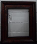 An 18th century ebonised and tortoiseshell picture frame. 79 x 95.5 cm.