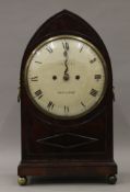 An early 19th century arched mahogany bracket clock, the dial inscribed Campbell Oswestry.