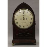 An early 19th century arched mahogany bracket clock, the dial inscribed Campbell Oswestry.