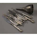 A small quantity of silver and silver handled cutlery, and a plated wine funnel. 115.