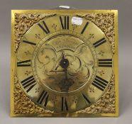 An antique longcase clock movement, the brass dial inscribed Cha Snuggs Farnham. 25 cm square.