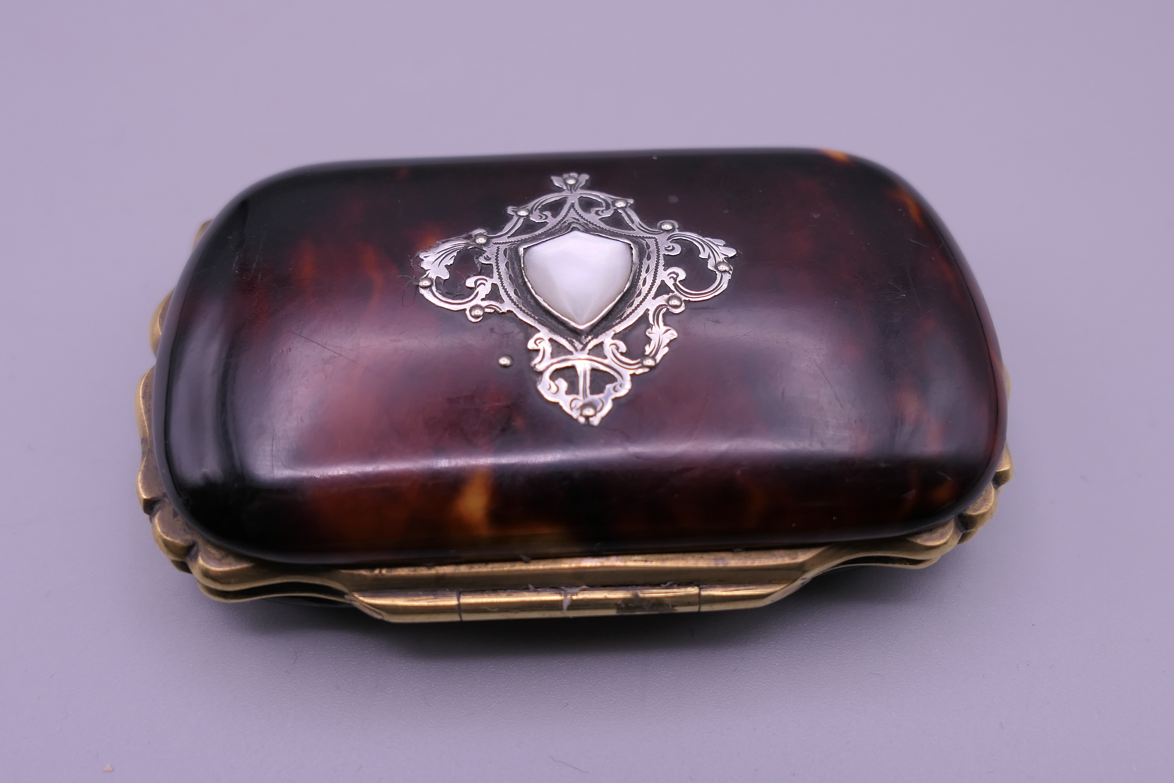 A Victorian silver and tortoiseshell purse lined with silk. 7.5 cm wide. - Image 2 of 4