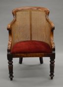 A Victorian mahogany bergere arm chair. 56 cm wide.