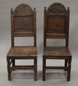 Two 18th century oak panel back chairs. The largest 45 cm wide.