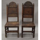 Two 18th century oak panel back chairs. The largest 45 cm wide.