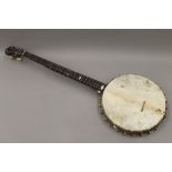 A 19th century Fairbanks and Cole of Boston Massachusetts banjo. 89 cm long.