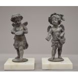 A pair of spelter figures. 18 cm high.