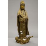 A late 19th century gilt bronze figure of Guanyin. 59 cm high.