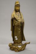A late 19th century gilt bronze figure of Guanyin. 59 cm high.