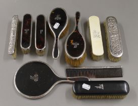 A silver and tortoiseshell dressing table set,