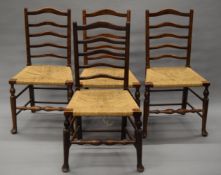 A set of four late 19th/early 20th century ladder back chairs. 49 cm wide.